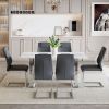 Table and chair set.63*31.4 Inch Snow Mountain White Sintered Stone Dining Table Set - 6 Dark Gray High-quality PU Chairs With Arched Metal Legs.Perfe
